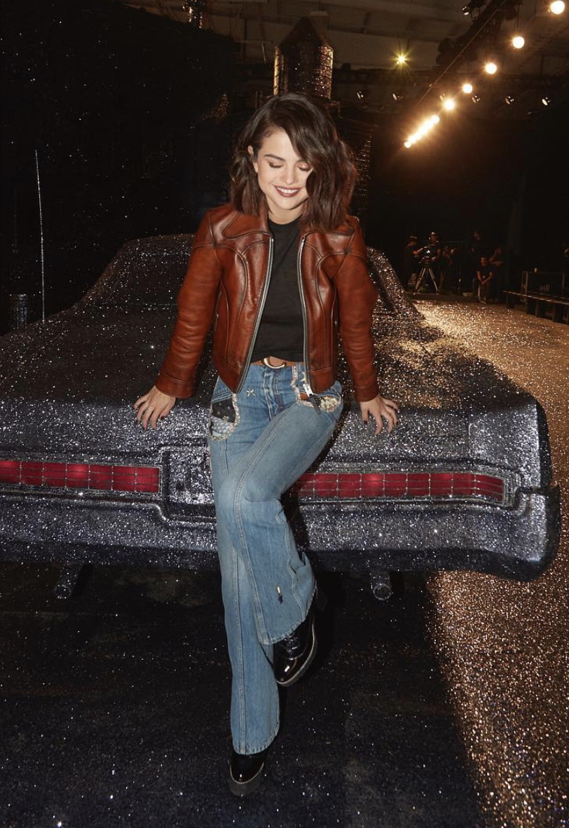 <p>Even Selena Gomez couldn’t resist snapping a pic next to the glittery car at Coach. <em>[Photo: Coach/ Instagram]</em> </p>