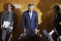 FILE - In this March 19, 2019, file photo, International Olympics Committee member and head of the Japanese Olympic Committee Tsunekazu Takeda bows as he speaks after a JOC executive board meeting in Tokyo. rench prosecutors believe Tokyo landed the Olympics by channeling bribes to IOC voters. Takeda, an IOC member at the time and head of the Japanese Olympic Committee, was forced to resign two years ago in the vote-buying scandal. (AP Photo/Eugene Hoshiko, File)