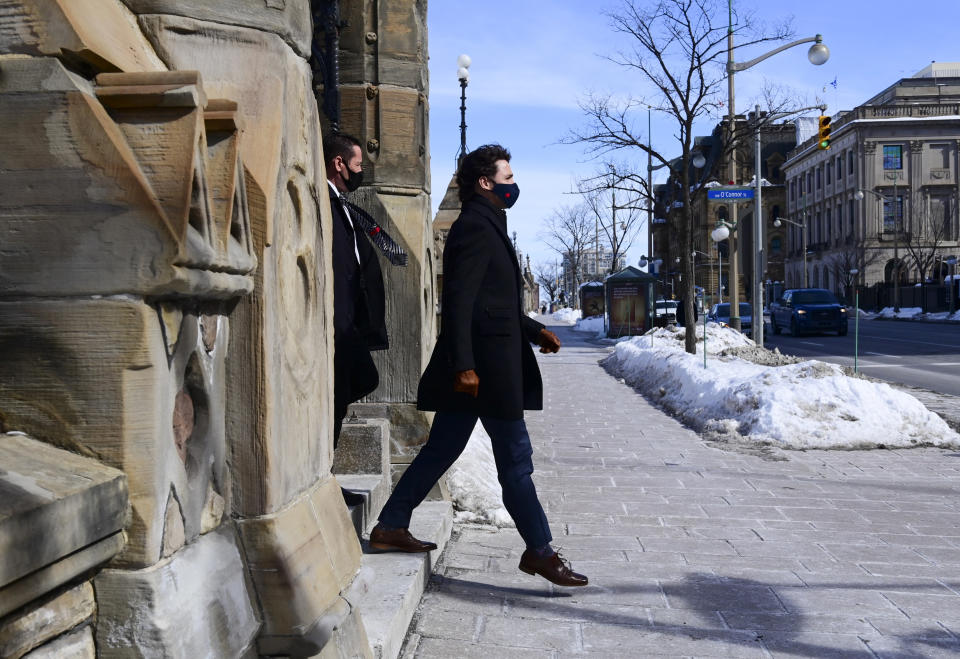 Canadian Prime Minister Justin Trudeau makes his way to hold a press conference in Ottawa, Ontario, Friday, March 5, 2021. (Sean Kilpatrick/The Canadian Press via AP)