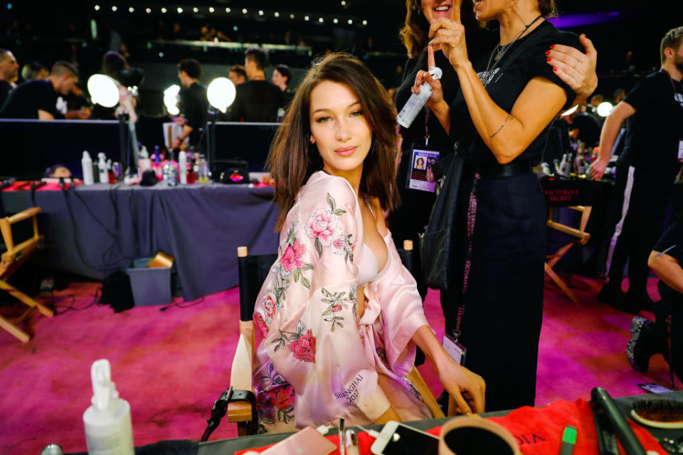 Bella Hadid posing during hair and makeup. (Photo: Getty Images)