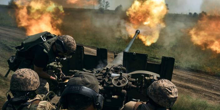 Ukrainian soldiers fire a cannon near Bakhmut, an eastern city where fierce battles against Russian forces have been taking place, in the Donetsk region, Ukraine, Monday, May 15, 2023.