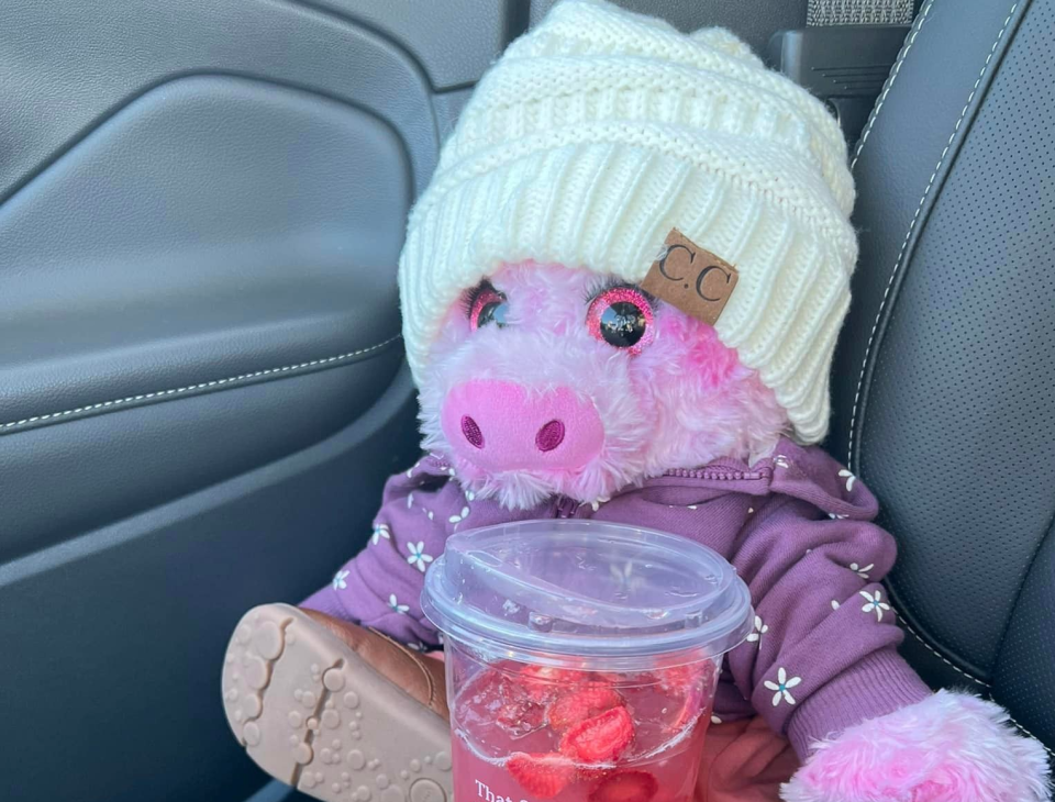 Piggy enjoys a fruity drink from Starbucks.