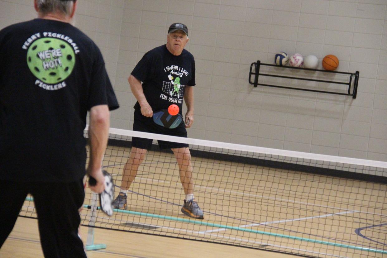 Steve McPherson hits the ball over the net during a tournament hosted by the Perry Picklers Pickleball Club on Tuesday, March 15, 2022, at the McCreary Community Building in Perry.