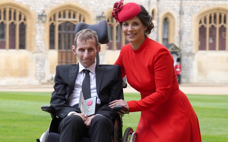 Burrow with his wife Lindsey following his appointment as MBE in 2022