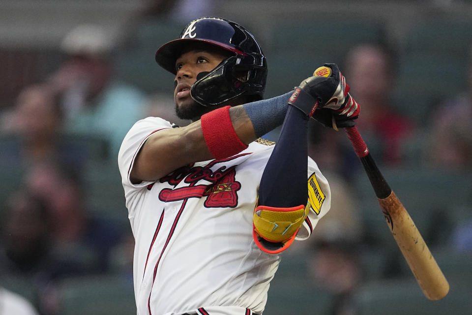 Atlanta Braves' Ronald Acuna Jr. watches his solo home run in the first inning of a baseball game against the Philadelphia Phillies Tuesday, Sept. 19, 2023. (AP Photo/John Bazemore)