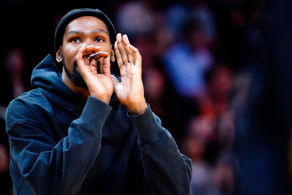 Phoenix Suns forward Kevin Durant (35) practices his shot during a time out against the Orlando Magic in the second half at Footprint Center in Phoenix on March 16, 2023.