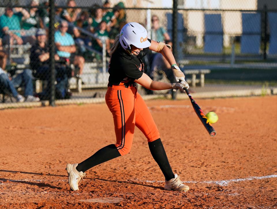 Spruce Creek's Avery Helms connects for a rbi single during a game with Flagler Palm Coast at Spruce Creek High School in Port Orange, Thursday, March 30, 2023