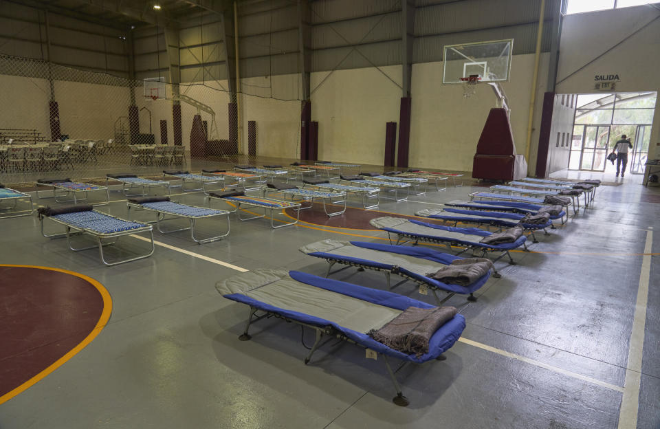 Cots are installed in a gym turned into a temporary shelter before the arrival of Hurricane Hilary, in Ensenada, Mexico, Saturday, Aug. 19, 2023. (AP Photo/Alex Cossio)