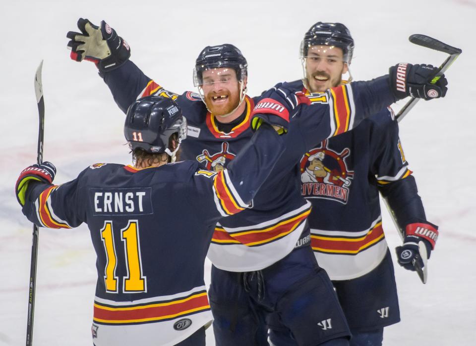 Peoria's Alec Hagaman, middle, Jordan Ernst, left, and Zach Wilkie celebrate their 3-2 win over the Quad City Storm in Game 3 of the SPHL semifinals Saturday, April 23, 2022 at Carver Arena in Peoria. The Rivermen advance to the finals against the Roanoke Rail Yard Dawgs.