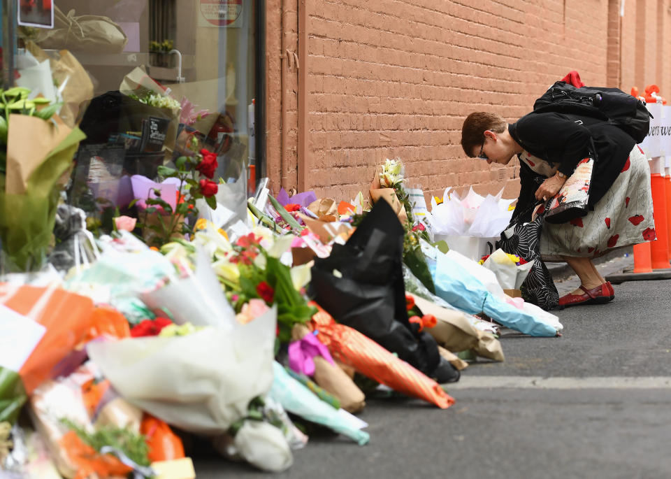 People leave flowers out the front of Pellegrini’s Espresso Bar in respect for Sisto. Image: Getty