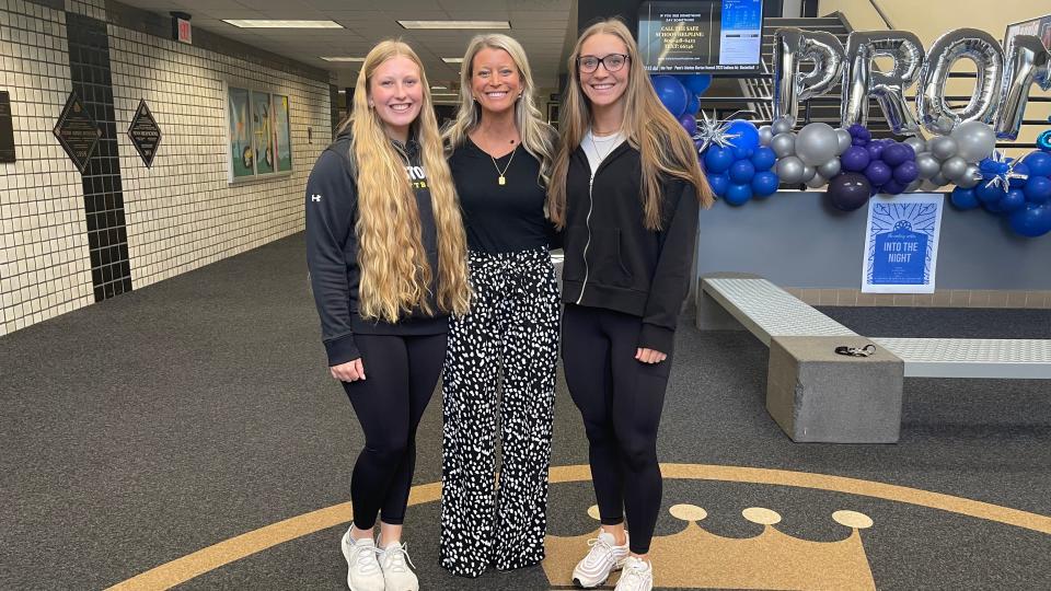 Penn softball coach Beth Zachary (center) poses for a photo with her daughters, junior pitcher Aubrey (left) and sophomore infielder Ava.