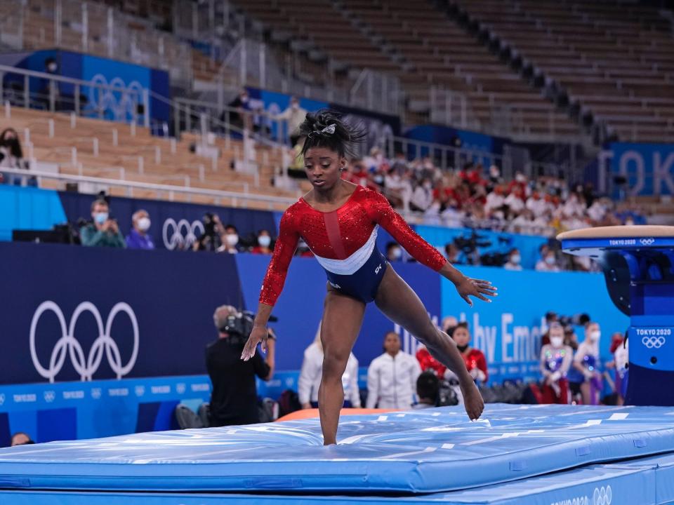 Simone Biles lands after her vault routine.