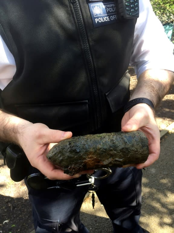 British police released an image showing an officer holding an item of unexploded ordinance that was recovered from the River Thames near Putney Bridge on April 2, 2017