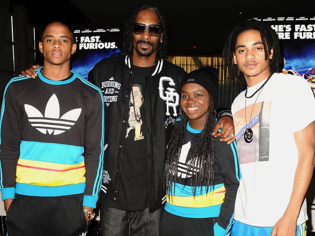 <p>Jason LaVeris/FilmMagic</p> Snoop Dogg with three of his kids — Cordell, Cori and Corde