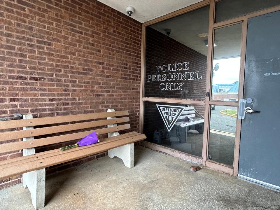 A lone bouquet sits outside the Deptford Township Police Department. Officers are mourning the loss of Bobby Shisler, who died Sunday from injuries sustained in the line of duty March 10.