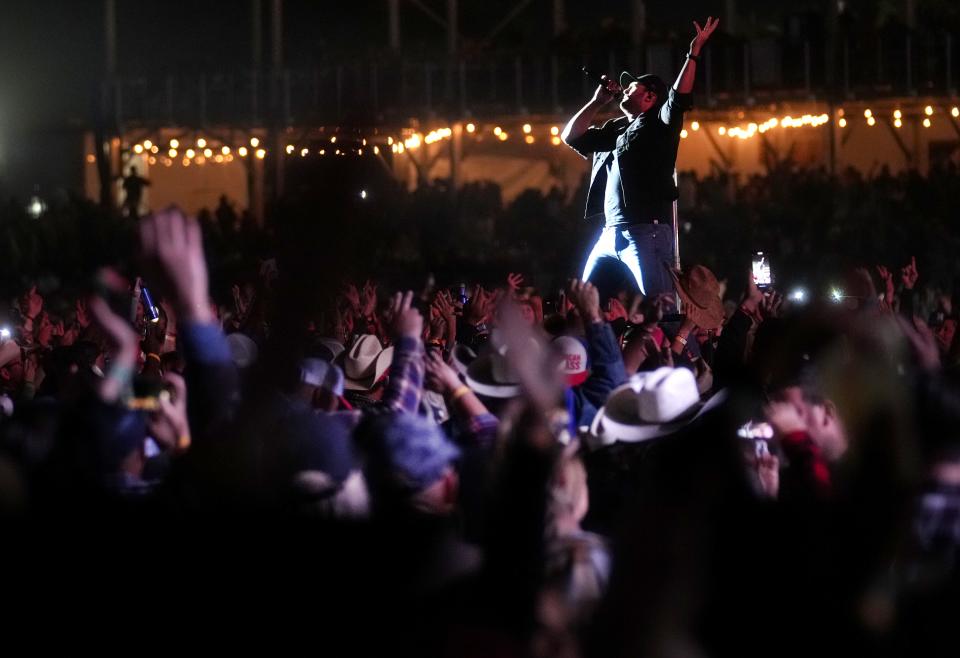 Luke Bryan performs with his band at the Country Thunder music festival on April 14, 2023.