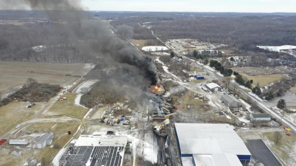 This photo taken with a drone shows portions of a Norfolk and Southern freight train that derailed Friday night in East Palestine, Ohio are still on fire at mid-day Saturday, Feb. 4, 2023. (AP Photo/Gene J. Puskar)