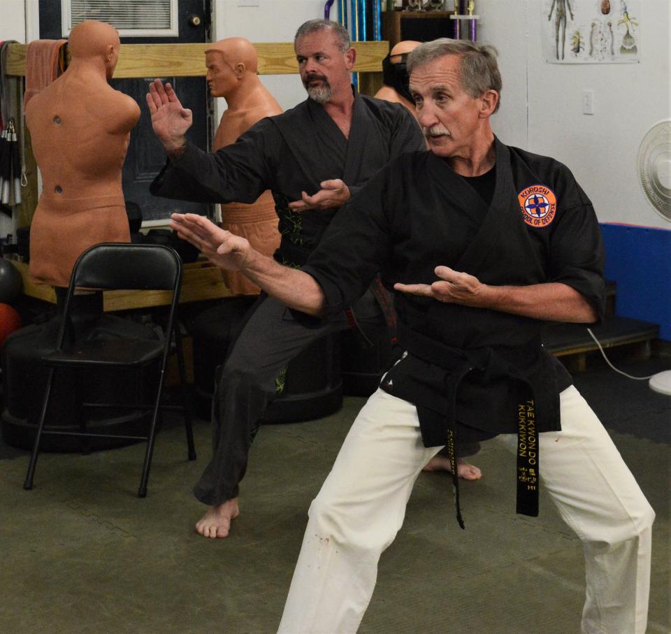 Local martial artist Master Brad Seward (back) works with his instructor, Grand Master Chuck Chirdon, in his home dojo in Nashport. Seward was inducted into The Cleveland Martial Arts Hall of Fame on April 1. He has been involved with martial arts for more than 20 years and runs Coszacks Elite Defense System in Nashport.
