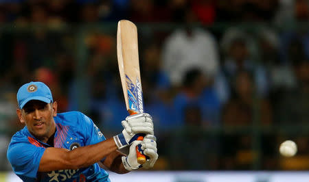 Cricket - India v England - Third T20 International - M Chinnaswamy Stadium, Bengaluru, India - 01/02/17. India's Mahendra Singh Dhoni plays a shot. REUTERS/Danish Siddiqui