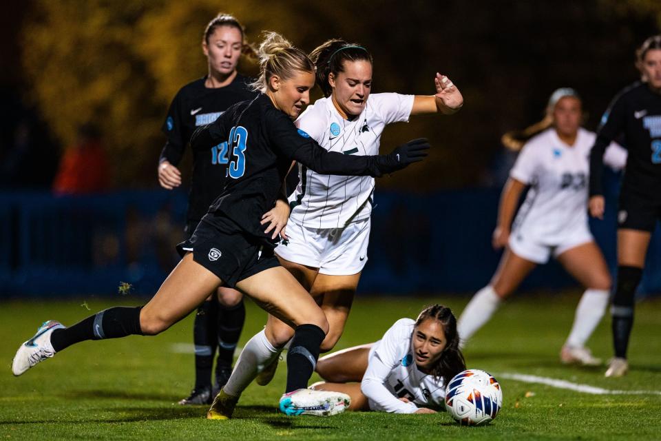 Brigham Young University forward Allie Fryer (23) and Michigan State midfielder Regan Dalton (5) chase after the ball during the Sweet 16 round of the NCAA College Women’s Soccer Tournament at South Field in Provo on Saturday, Nov. 18, 2023. | Megan Nielsen, Deseret News