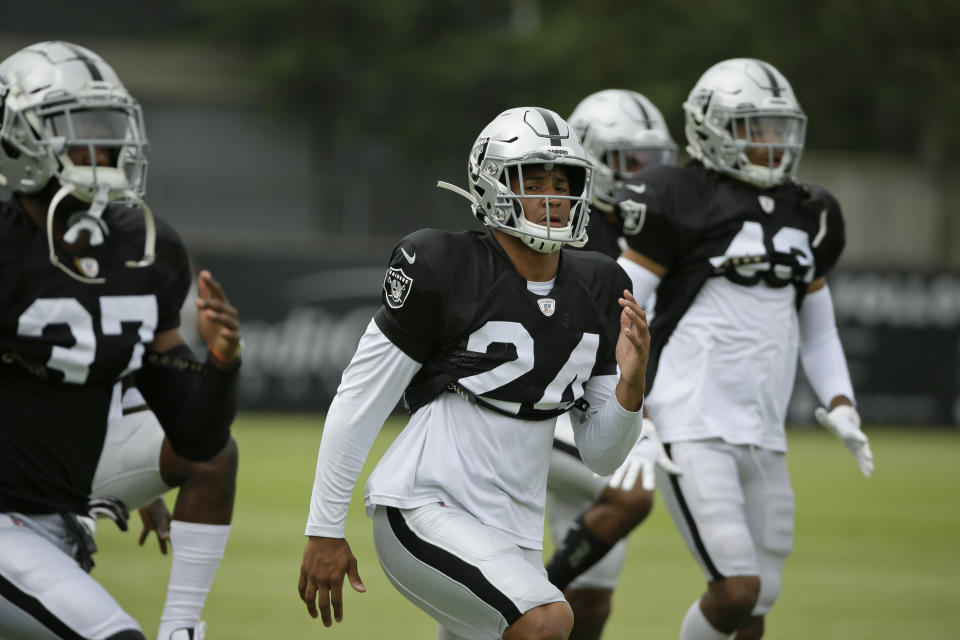 Oakland Raiders defensive back Johnathan Abram stretches during NFL football training camp Monday, July 29, 2019, in Napa, Calif. (AP Photo/Eric Risberg)