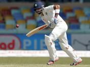 India's captain Virat Kohli plays a shot on the second day of their third and final test cricket match against Sri Lanka in Colombo, August 29, 2015. REUTERS/Dinuka Liyanawatte