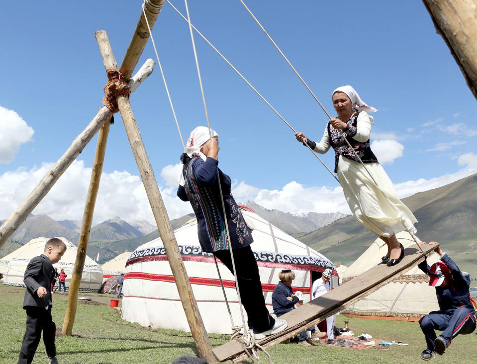 Kyrgyz woman swing in Bishkek, Kyrgyzstan