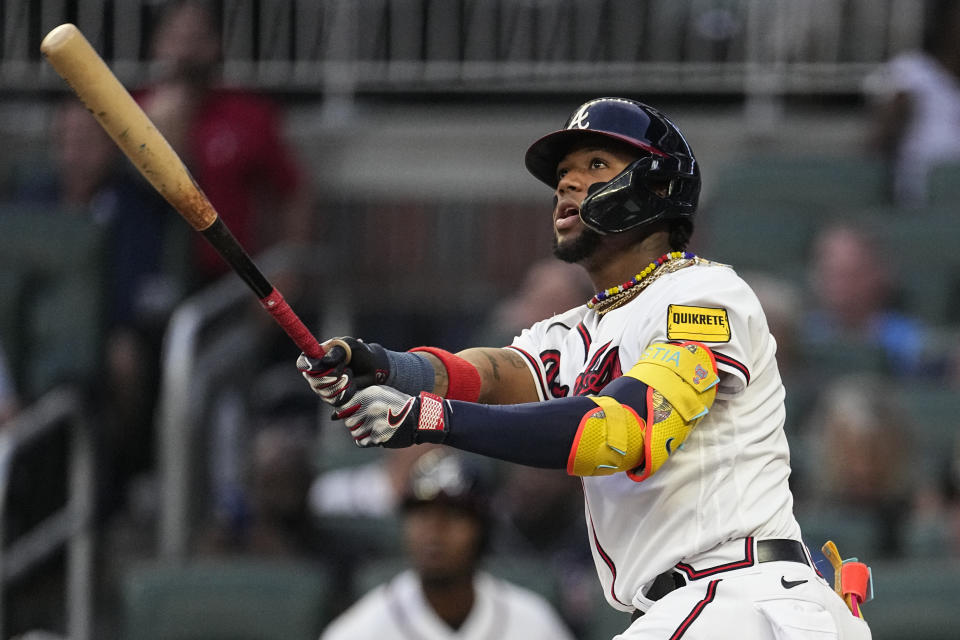 Atlanta Braves' Ronald Acuna Jr. watches his solo home run in the first inning of a baseball game against the Philadelphia Phillies Tuesday, Sept. 19, 2023. (AP Photo/John Bazemore)