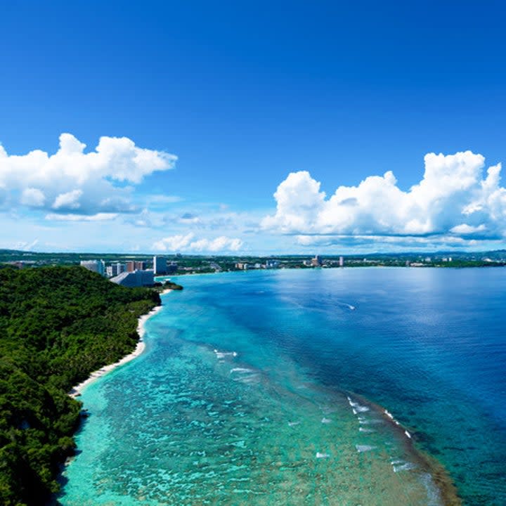 <div><p>"My family (myself, my husband, and toddler) went to Guam last year — we live in Japan so it’s an easy three-hour flight. It’s a small island; <b>you can drive from one end to the other in about an hour</b>. But man, is it beautiful! It's so tropical, like a mini Hawaii. I definitely recommend going if you have the chance!" </p><p>—<a href="https://www.buzzfeed.com/stephanieb4ec469660" rel="nofollow noopener" target="_blank" data-ylk="slk:stephanieb4ec469660" class="link ">stephanieb4ec469660</a></p></div><span> Segawa7 / Getty Images, Yagi-studio / Getty Images</span>
