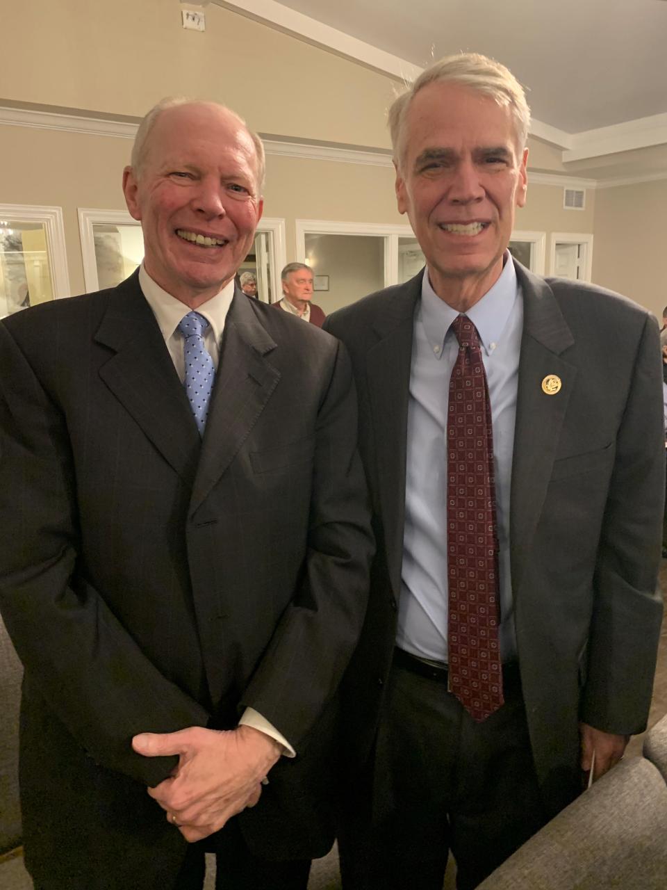City Law Director Charles Swanson, left, and U.S. District Judge Thomas Varlan pause for a photo while attending the funeral of former city fire chief Bruce Cureton on March 19.