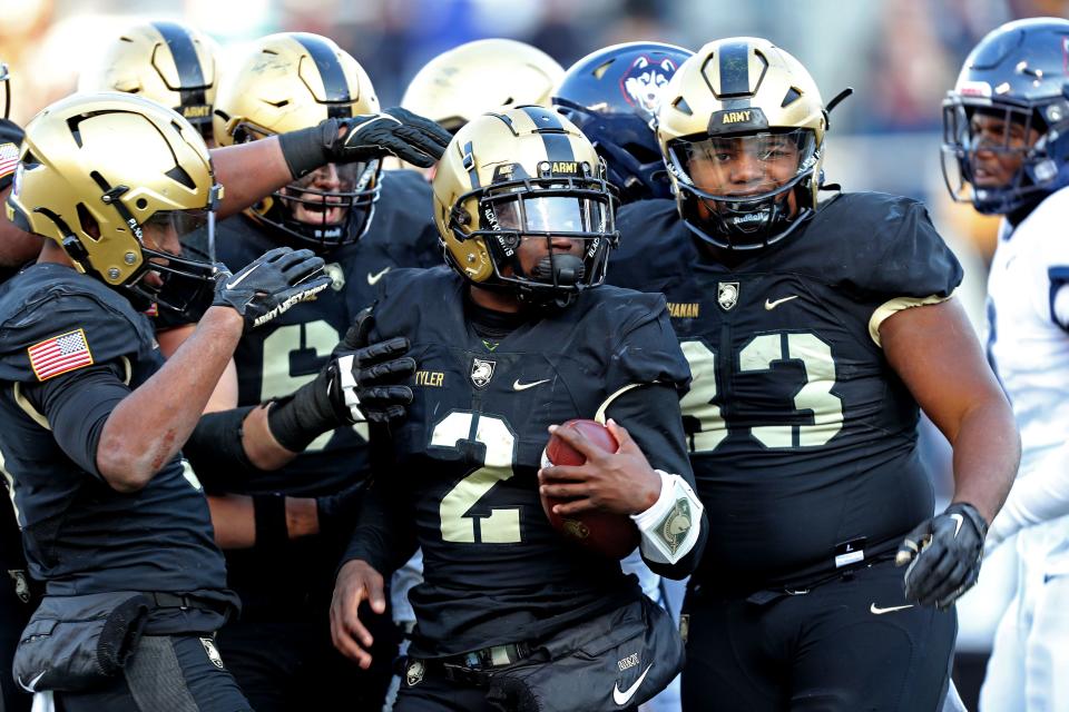 Army quarterback Tyhier Tyler (2) celebrates his touchdown against Connecticut. DANNY WILD/USA TODAY Sports