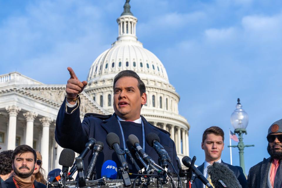 Rep. George Santos, R-N.Y., faces reporters at the Capitol in Washington, early Thursday, Nov. 30, 2023 (AP)