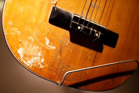 A guitar with engraved names is seen at the Bosnian War Childhood museum in Sarajevo, Bosnia and Herzegovina December 7, 2017. Picture taken December 7. REUTERS/Dado Ruvic