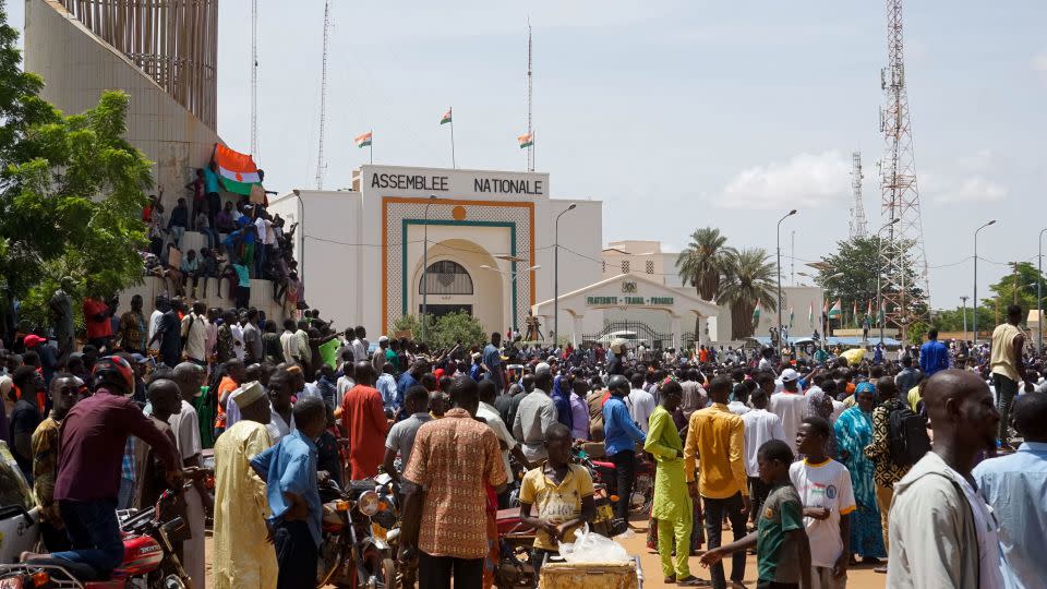 People gather outside the National Assembly building during a protest in Niamey, Niger, on July 30.  - Issifou Djibo/EPA-EFE/Shutterstock