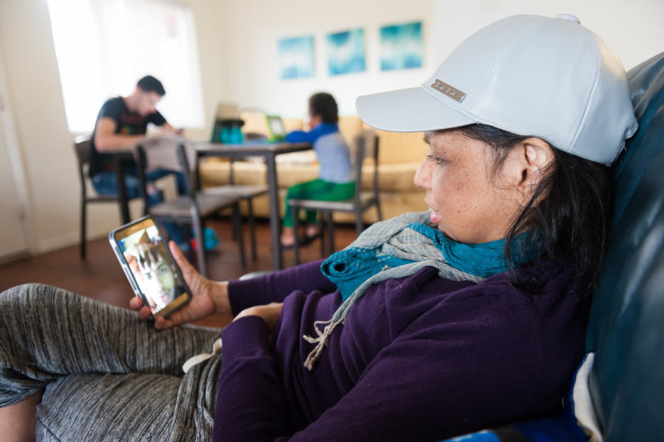 Mariluz talks on video chat with her son Jeancarlo. (Photo: Chris McGonigal/HuffPost)