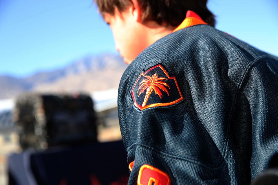 Youth hockey players wear the new Firebird hockey jersey during a reveal event at the Palm Springs Air Museum in Palm Springs, Calif., on Monday, Jan. 24, 2022. 