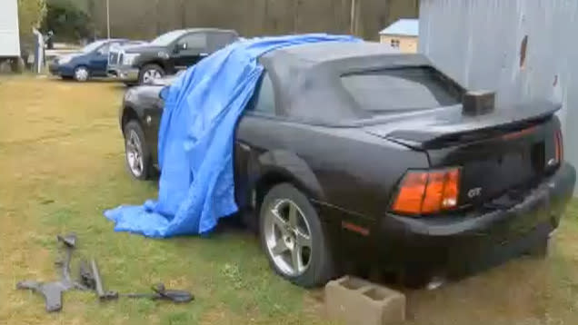 While working on his car, Allen Clemmons of South Carolina got trapped beneath it. (Screenshot: WIS TV)