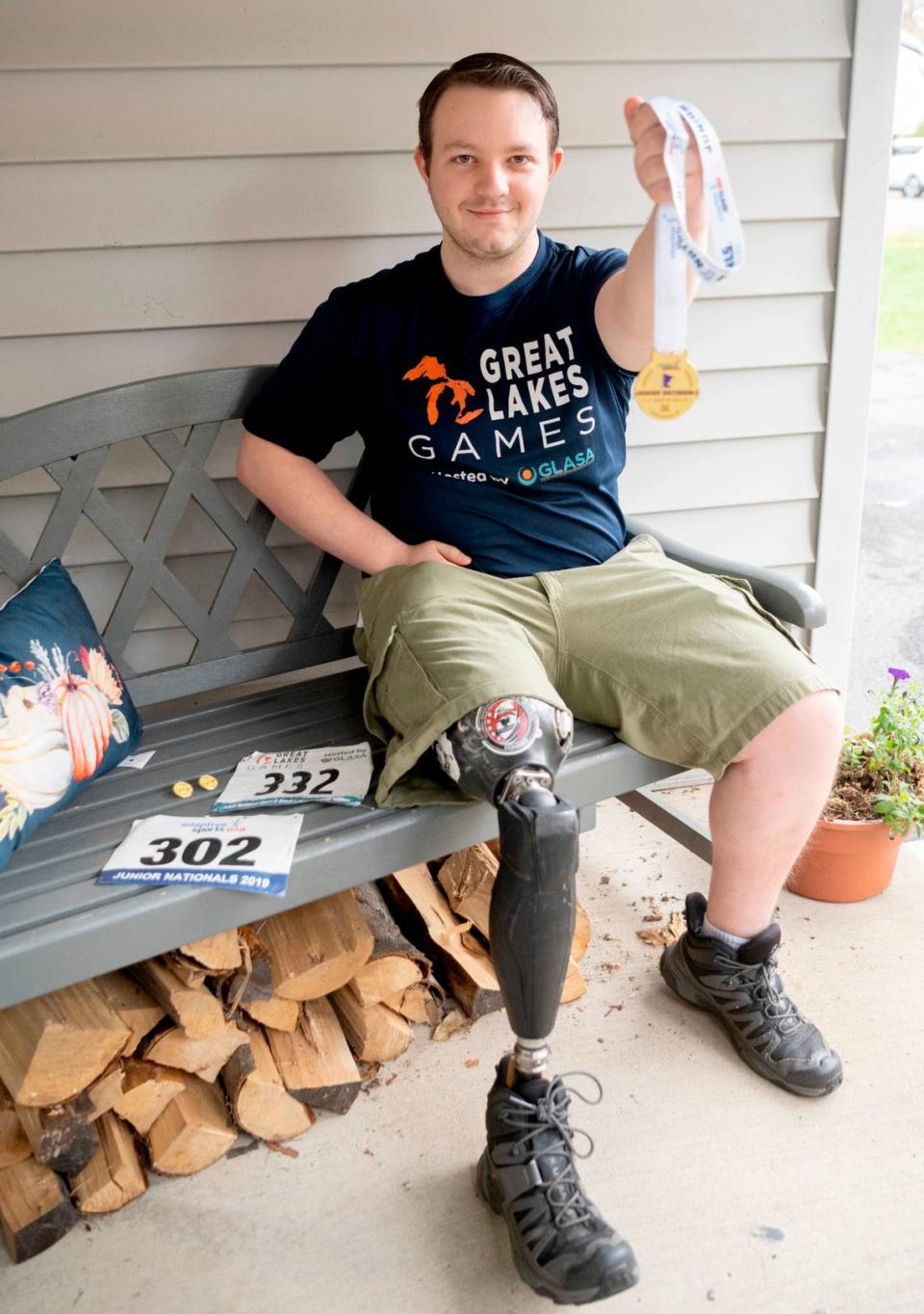 RJ Shirey holds up his gold medal from the adaptive sports junior nationals in 2019. Shirey wants to continue competing through Penn State Ability Athletics, which has been on pause since the pandemic.