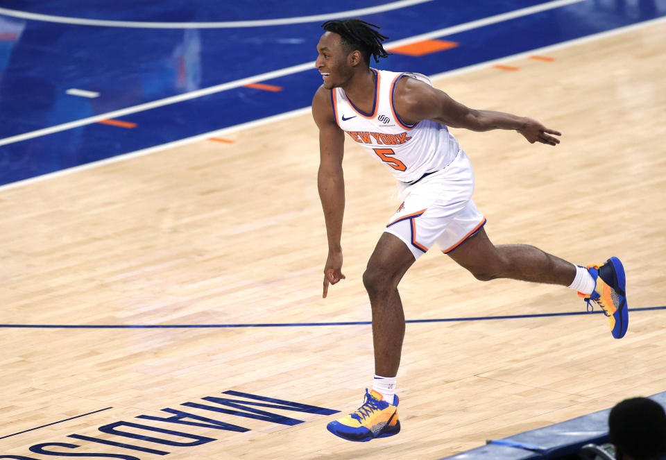 New York Knicks' Immanuel Quickley reacts after making a 3-point basket during the first half against the Charlotte Hornets in an NBA basketball game Tuesday, April 20, 2021, in New York. (Sarah Stier/Pool Photo via AP)