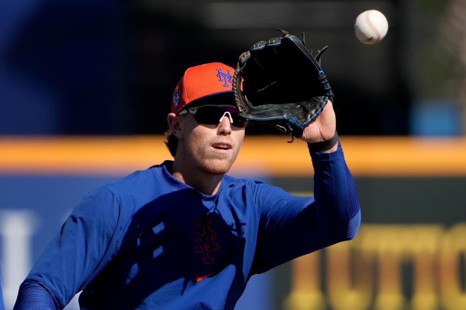 New York Mets' Brett Baty catches a ball during a spring training baseball workout Tuesday, Feb. 20, 2024, in Port St. Lucie, Fla.