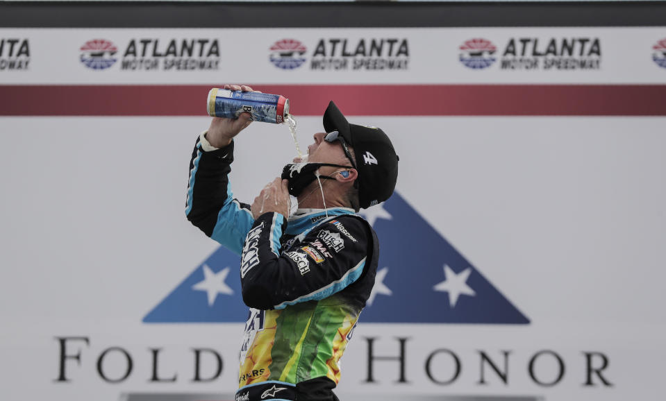 Kevin Harvick celebrates after winning a NASCAR Cup Series auto race at Atlanta Motor Speedway on Sunday. (AP Photo/Brynn Anderson)