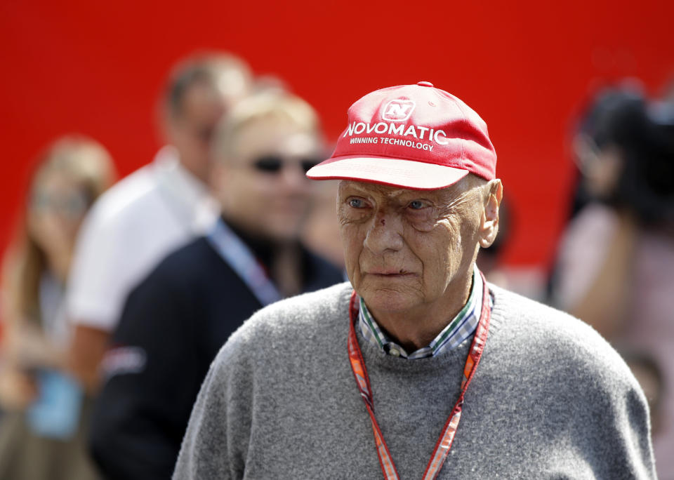 FILE - In this July 7, 2018 file photo former Formula One World Champion Niki Lauda of Austria walks in the paddock before the third free practice at the Silverstone racetrack, Silverstone, England. Niki Lauda hopes to “soon” be back working with Mercedes as he continues his recovery from a lung transplant. The three-time Formula One champion was smiling and cheery as he posted a message on the Mercedes team’s Twitter account on Saturday, Nov. 24. (AP Photo/Luca Bruno, file)