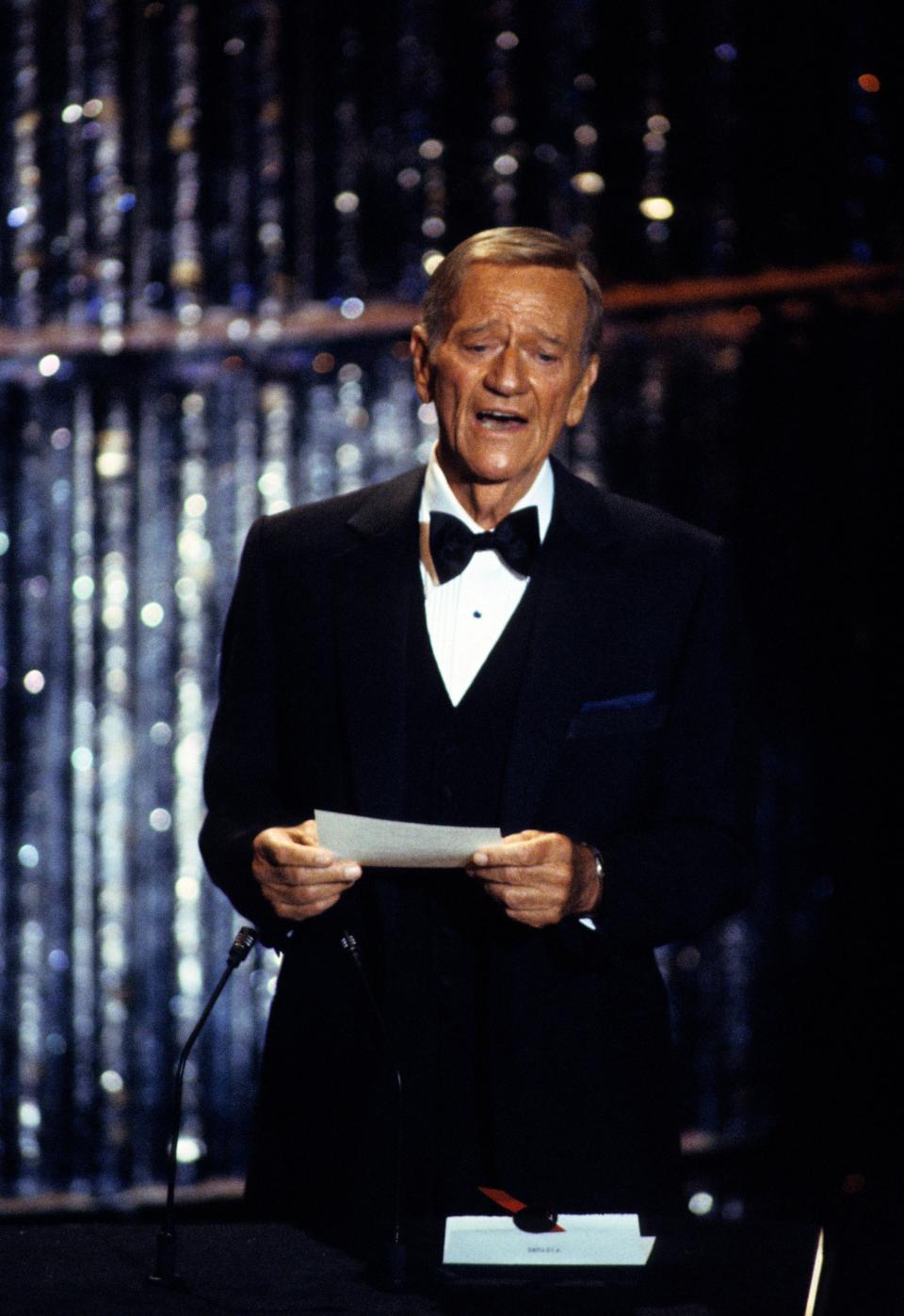 John Wayne presents Best Picture at the 51st Academy Awards, April 9, 1979.