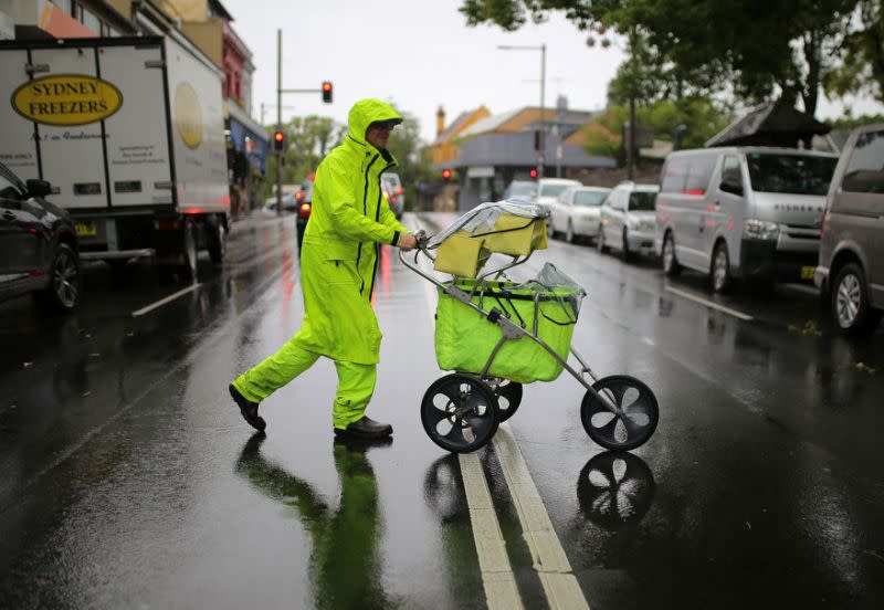 No amount of rain will stop this postie