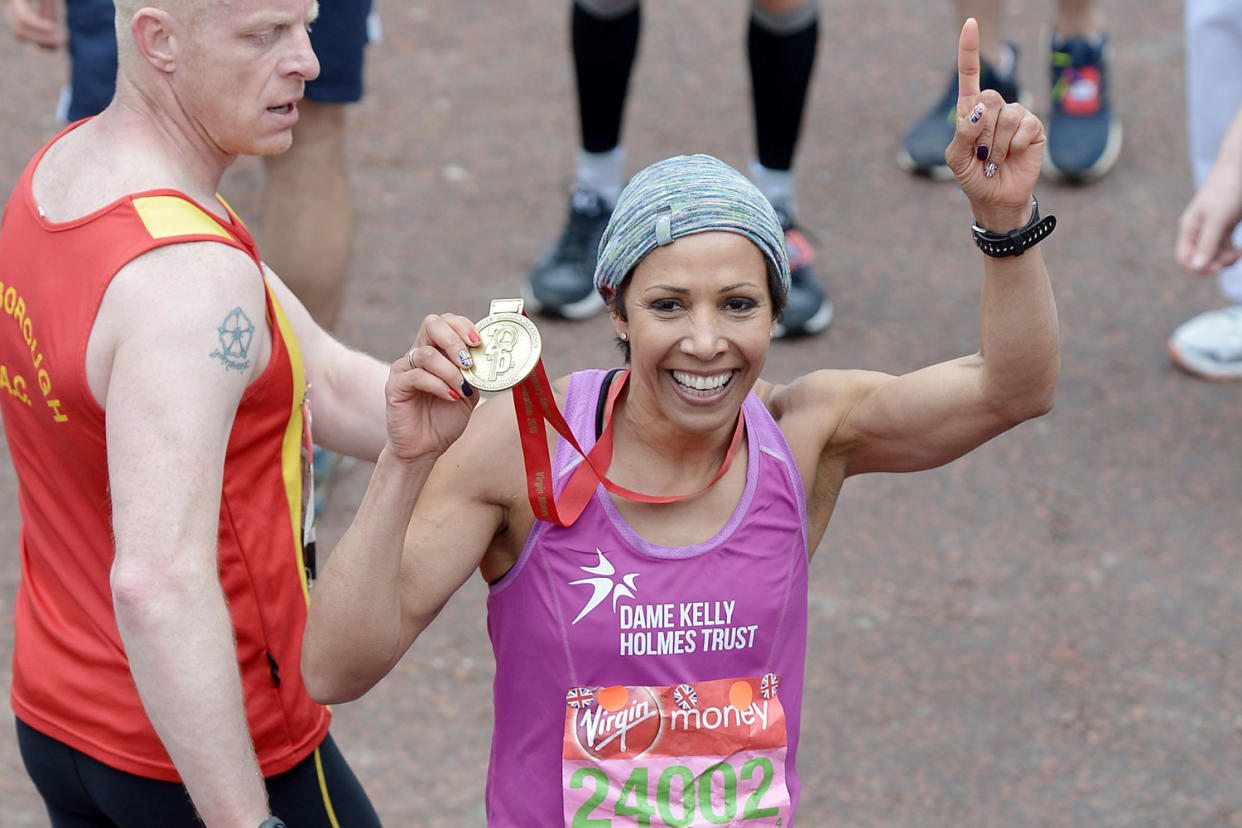 Dame Kelly Holmes poses with her medal after completing the 2016 London Marathon: Jeff Spicer/Getty Images