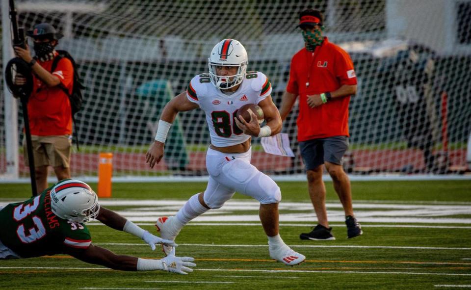 University of Miami freshman receiver Xavier Restrepo avoid Chantz Williams during the Hurricanes second scrimmage on Saturday, August 22, 2020.