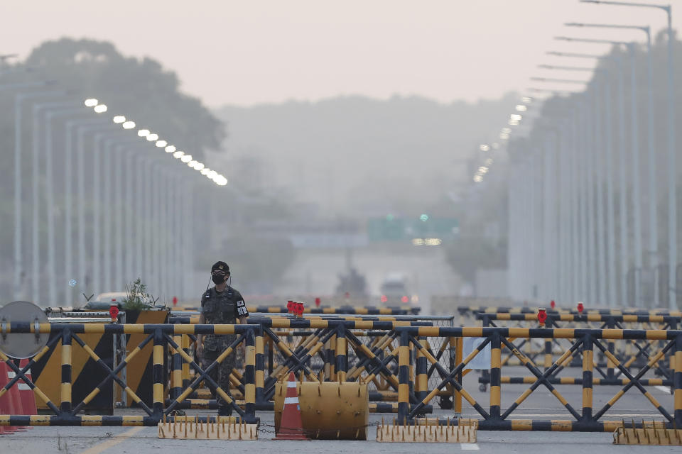 A South Korean army soldier patrols at the Unification Bridge, which leads to the Panmunjom border village in the Demilitarized Zone in Paju, South Korea. Tuesday, June 16, 2020. North Korea blew up an inter-Korean liaison office building just inside its border in an act Tuesday that sharply raises tensions on the Korean Peninsula amid deadlocked nuclear diplomacy with the United States. (AP Photo/Ahn Young-joon)