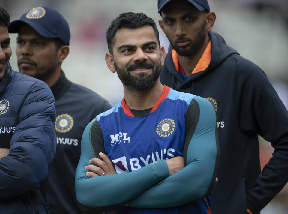 Virat Kohli (pictured) smiles during the trophy presentation after day five of the Fifth Test Match between England and India.