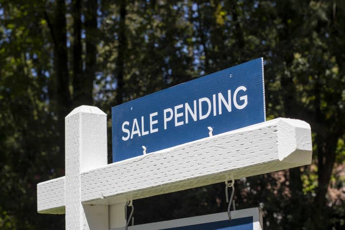 "a sale pending" sign outside