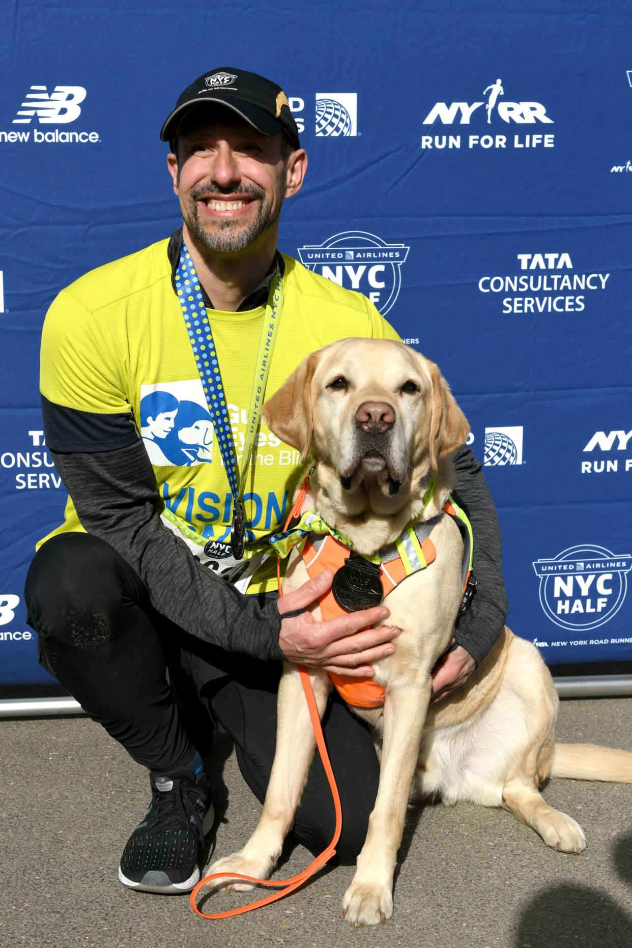 Guiding Eyes for the Blind President and CEO, Thomas Panek, runs the first-ever 2019 United Airlines NYC Half Led Completely by Guide Dogs, with Gus on March 17, 2019 in New York City. 